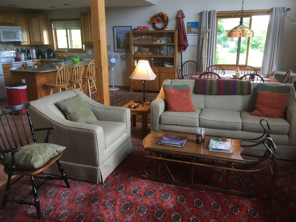 View of large  living room, kitchen and dining area  from home entry