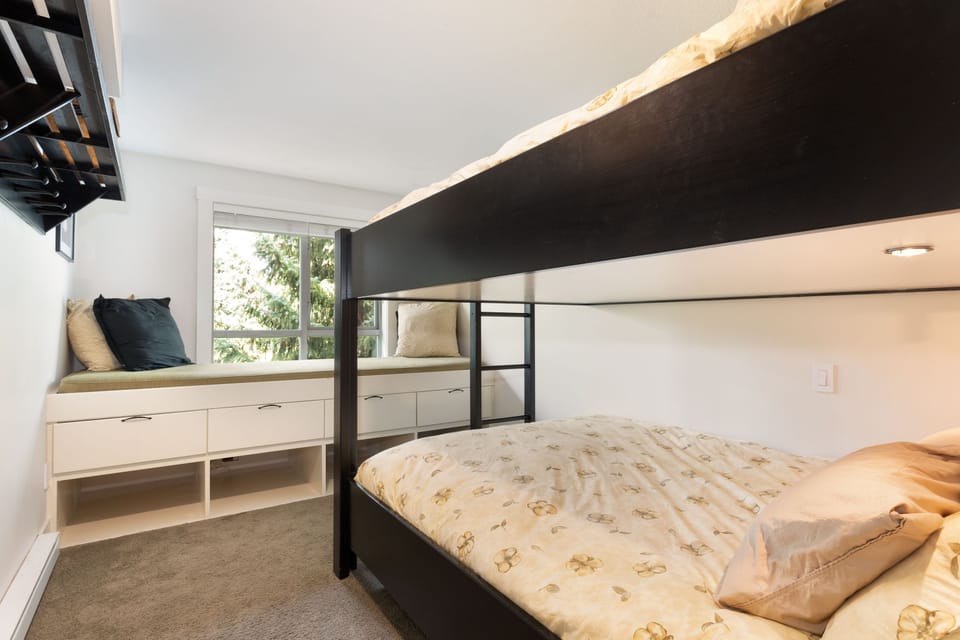 2nd Bedroom with queen bunk beds. Window seating,. Storage for ski boots etc