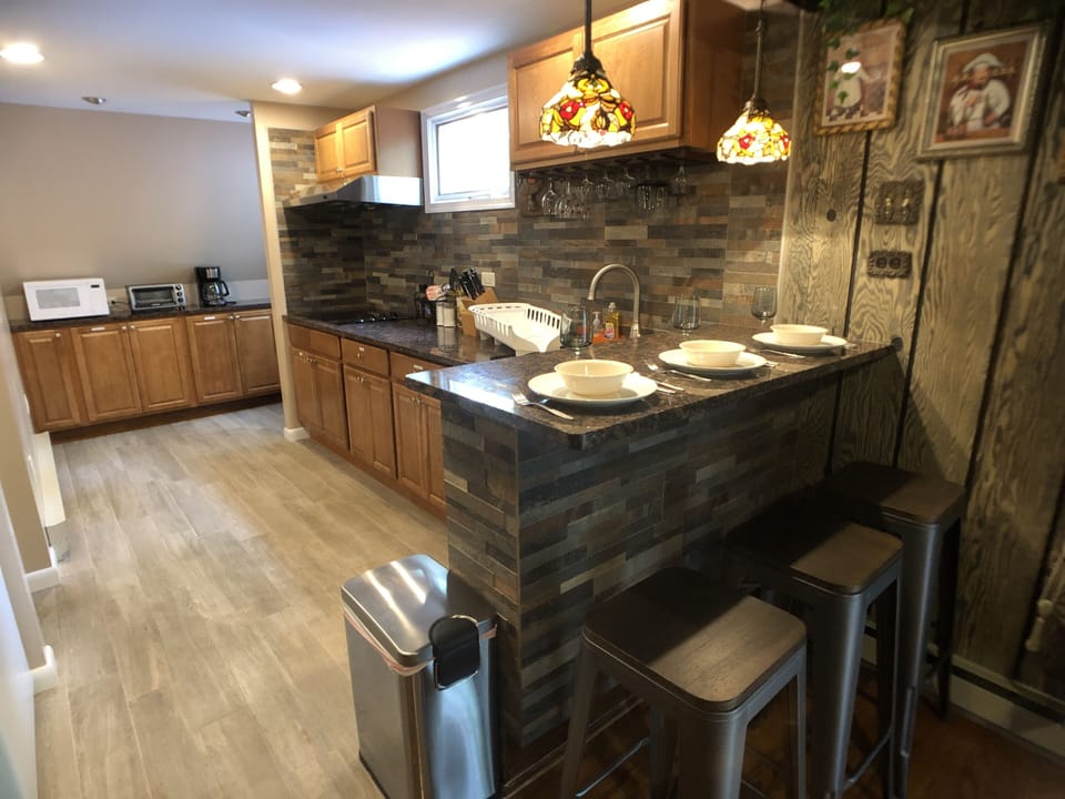 Kitchen with peninsula island bar.