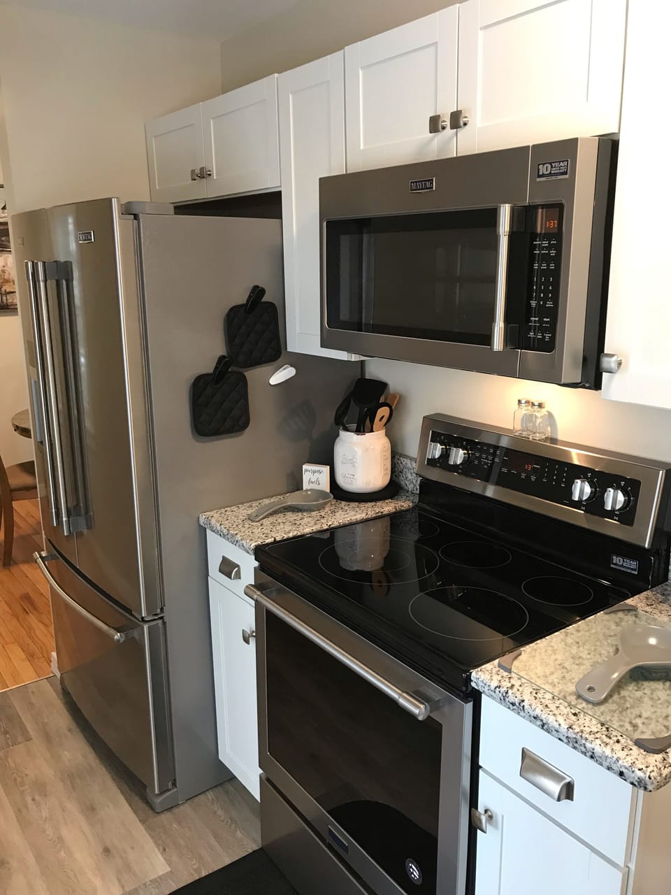 In love with the new steel gray appliances and granite countertops!