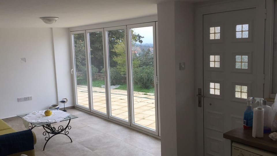 Bi-fold doors open directly from the lounge on to the patio
