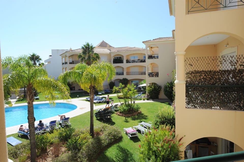 View of the Pool and lawns from balcony.