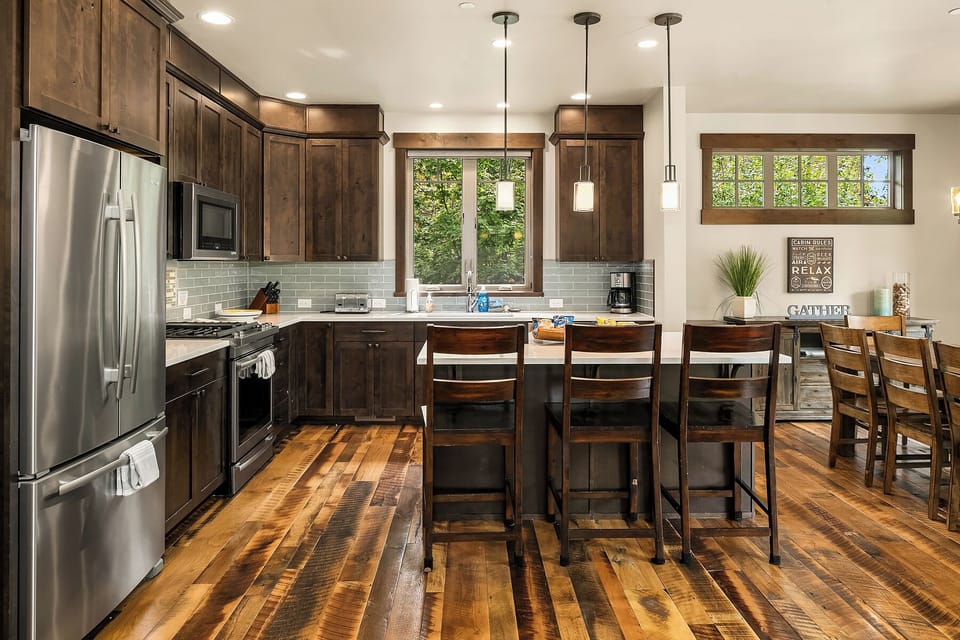 Kitchen with eating bar and dining room to the right. 