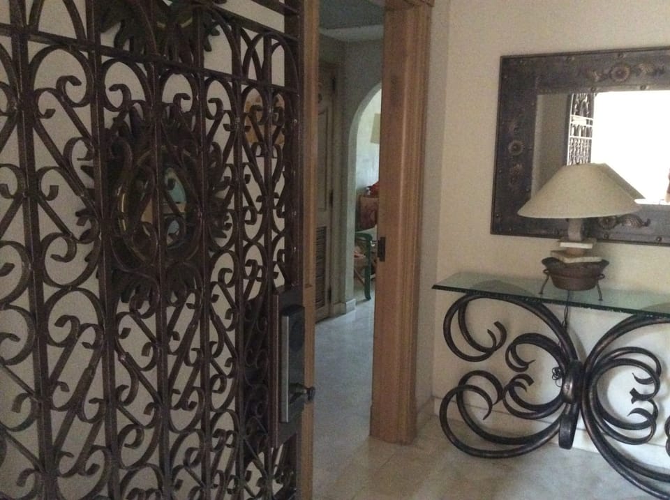 Entrance to foyer through locked gate to B-side