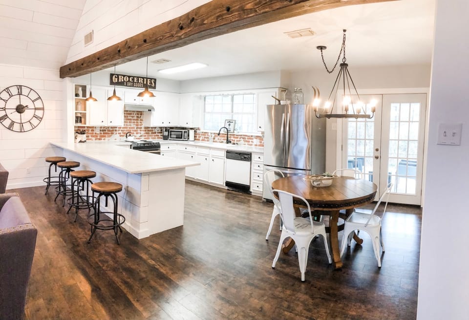 Kitchen in MAIN house is fully stocked. Have 2 fridges. Add dining on back porch