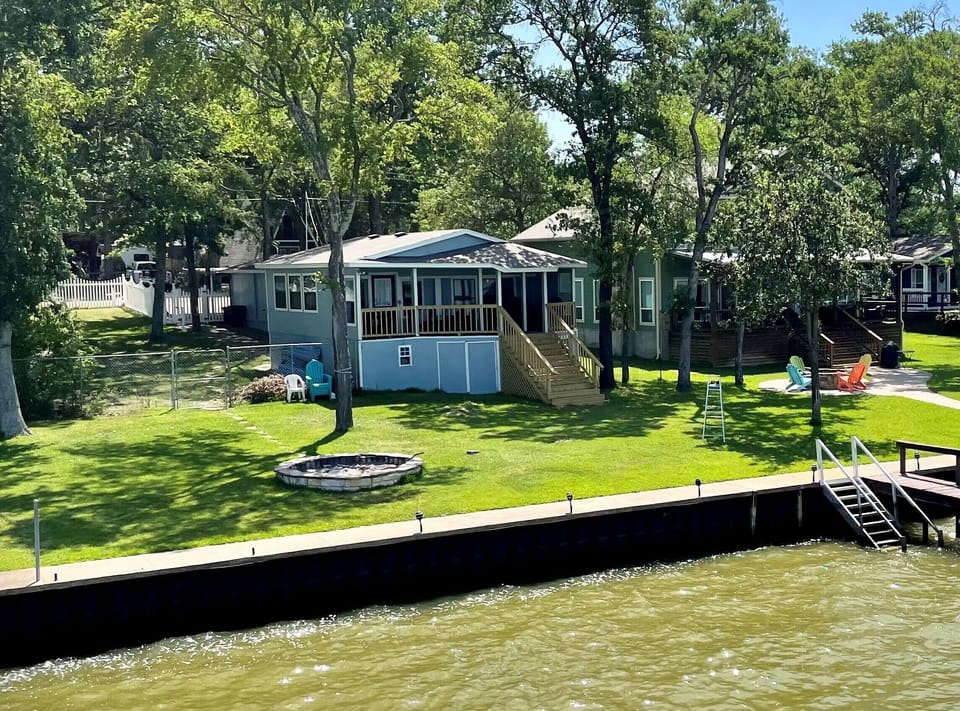 View from the water - big side yard & lots of lakefront with stairs! 