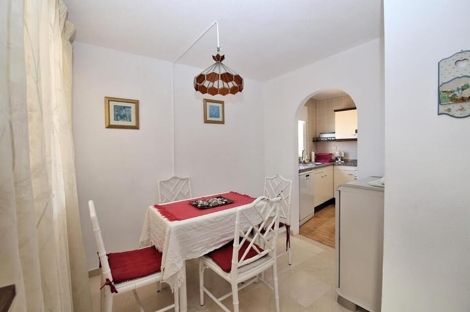 Dining area with seating for four guests