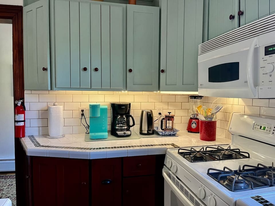 Coffee maker, Keurig, french press, coffee grinder, filters. Gas range.