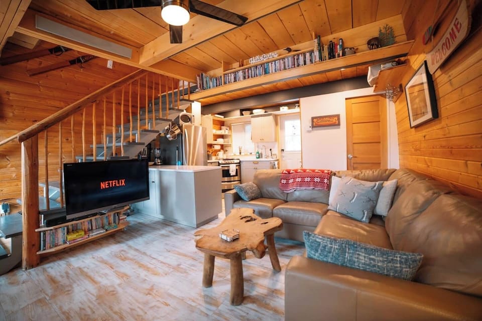 Cozy living room area with 42" Flat screen TV with Roku, Netflix, blue ray DVD player and a library of DVD's. 