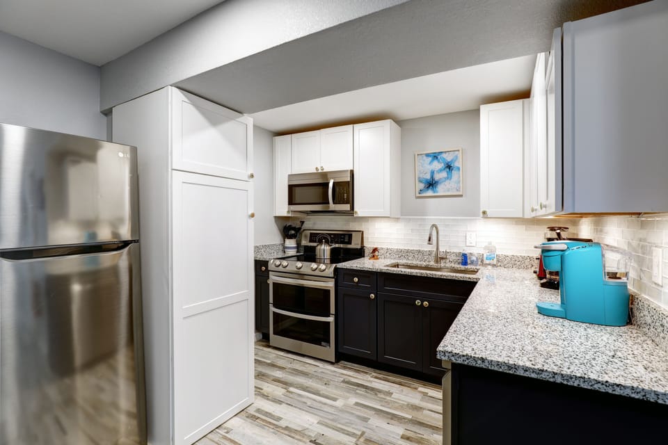 Kitchen area sporting all new cabinets and appliances. 