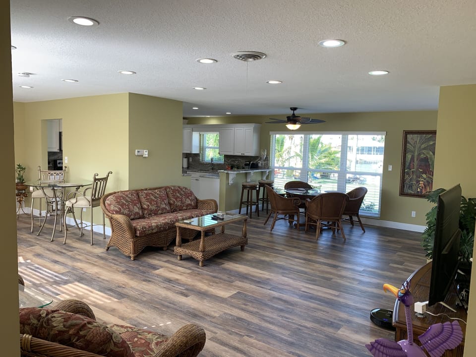TV room next to dining room and bar.