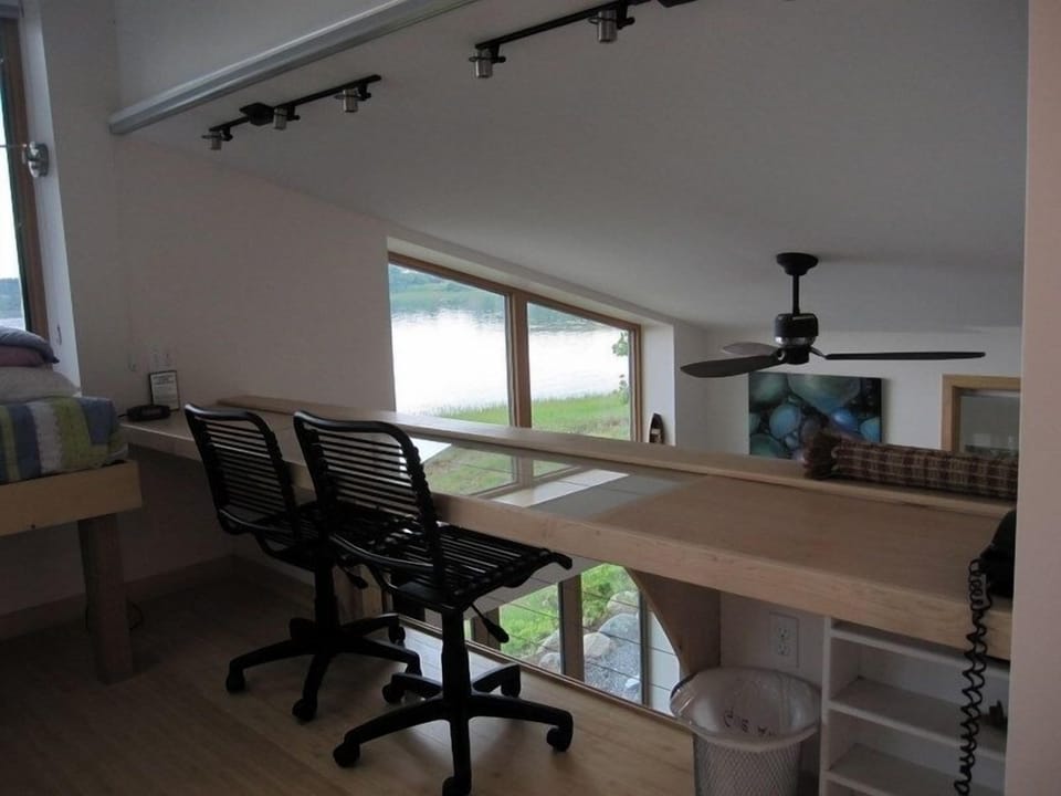 Desk in loft overlooking livingroom