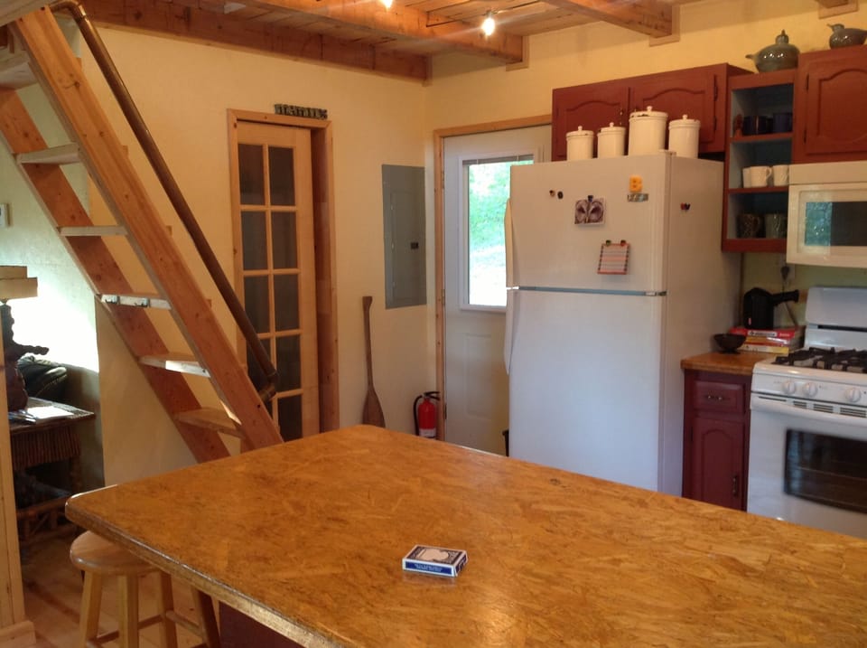 Kitchen and stairs going to sleeping quarters