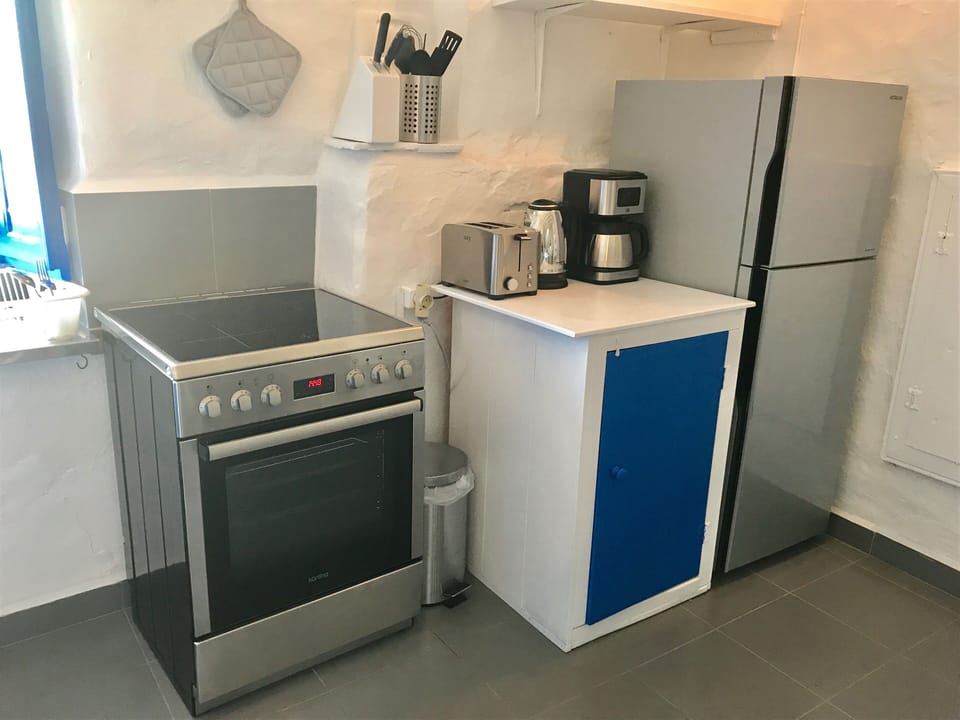 Kitchen area (partial view) with new stainless steel appliances.