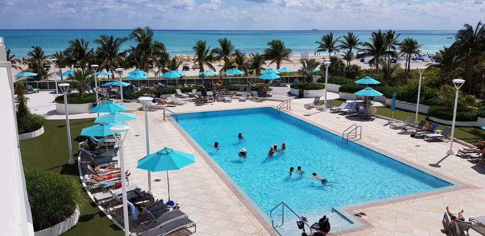view from balcony to private heated pool  and beach access 