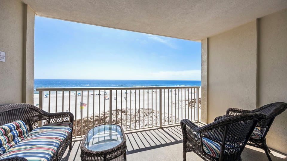 Royal Palms 406 - Covered balcony with outdoor furniture, perfect for enjoying the Gulf views.