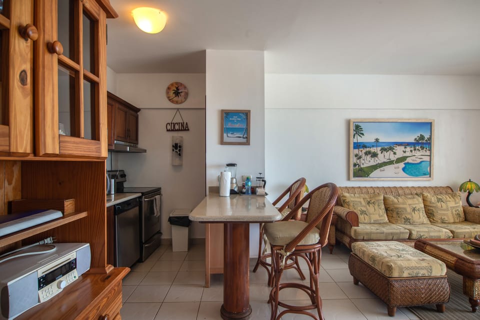 View of the Cozy Living Room, 2-Seats Breakfast Bar and Fully Equipped Kitchen