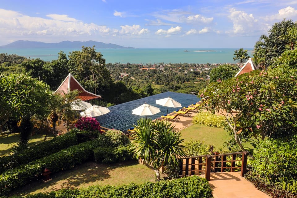 The villa is surrounded by a beautiful tropical garden.