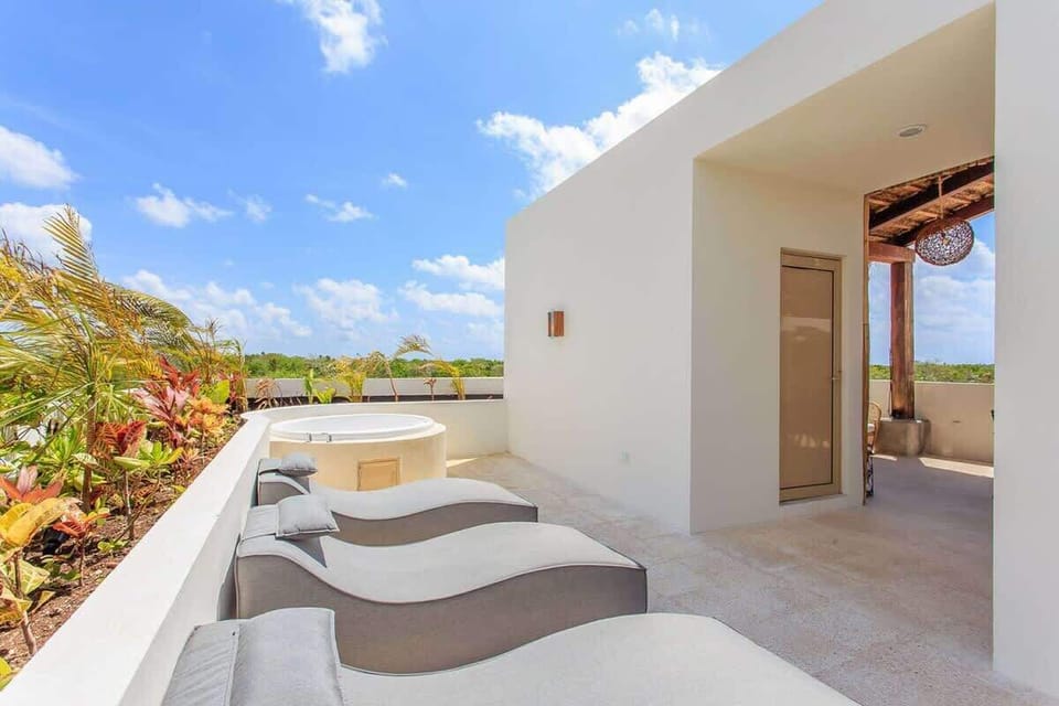 Your private rooftop has sun loungers & a jacuzzi!