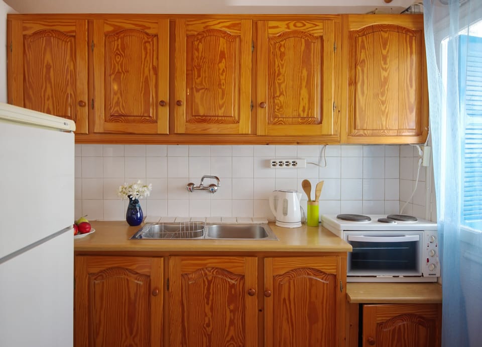 kitchen , small oven and 3 ring mini cooker , nespresso machine , fridge freezer