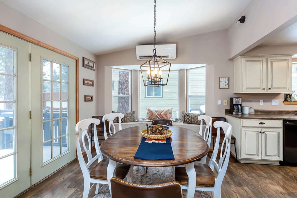 The door leading to the deck is right behind the dining room table. 