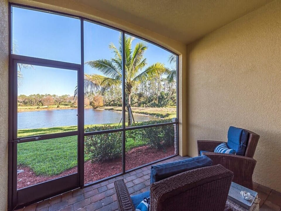 Rear lanai with view of water and 11th hole on golf course. 