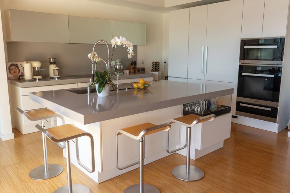Open concept Living room - Poggenpohl island kitchen with Miele appliances