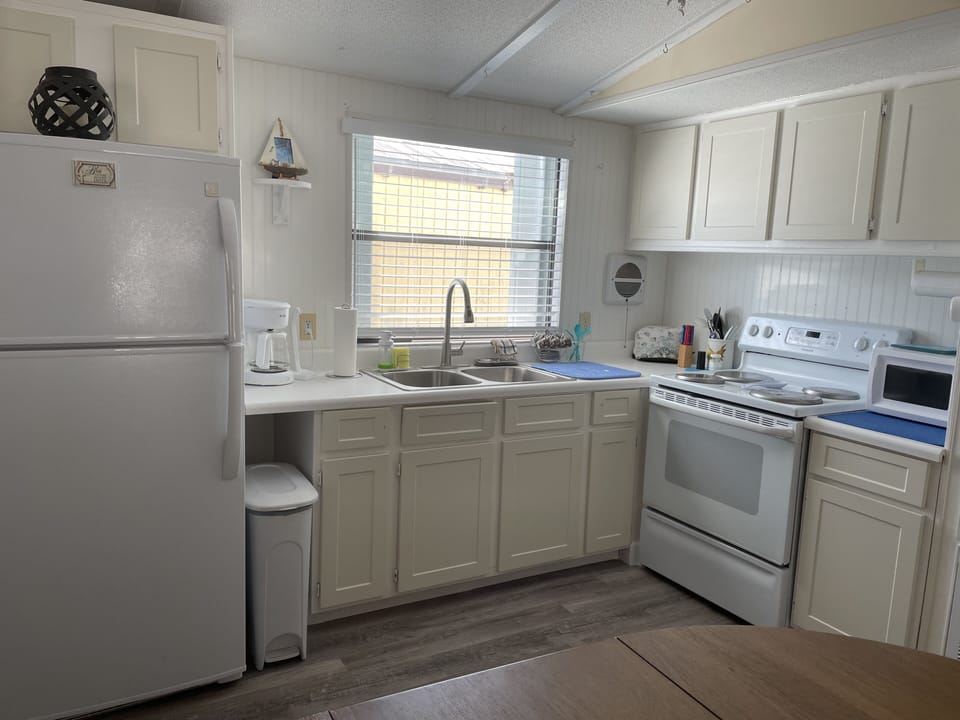 Kitchen is fully equipped and has a full size refrigerator