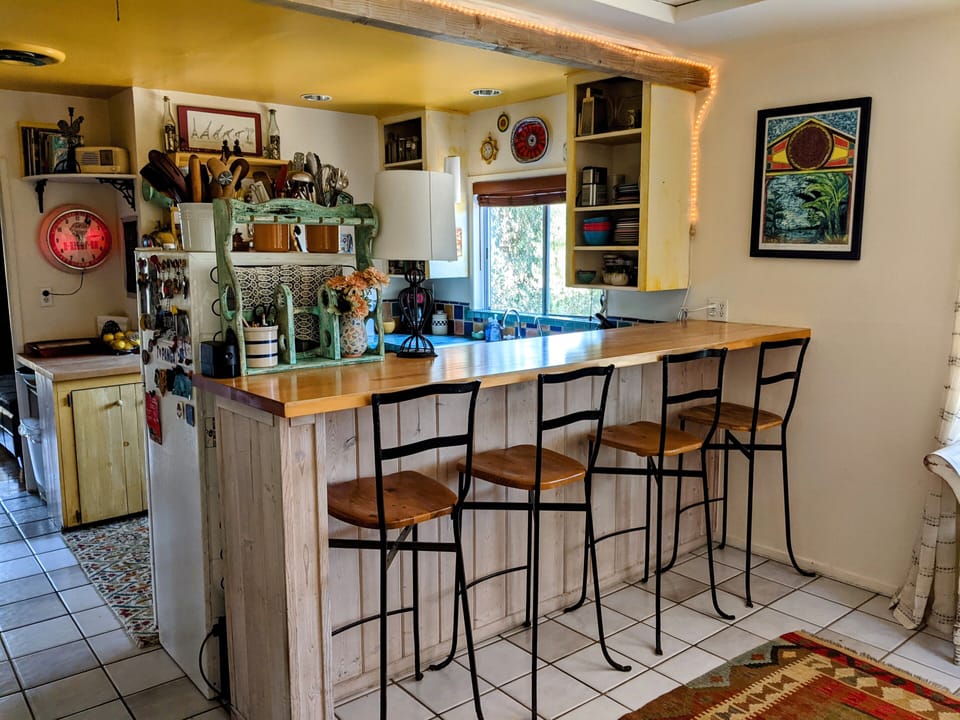 Maple countertop seats four; good area for dining or work (500up/down mbps wifi)
