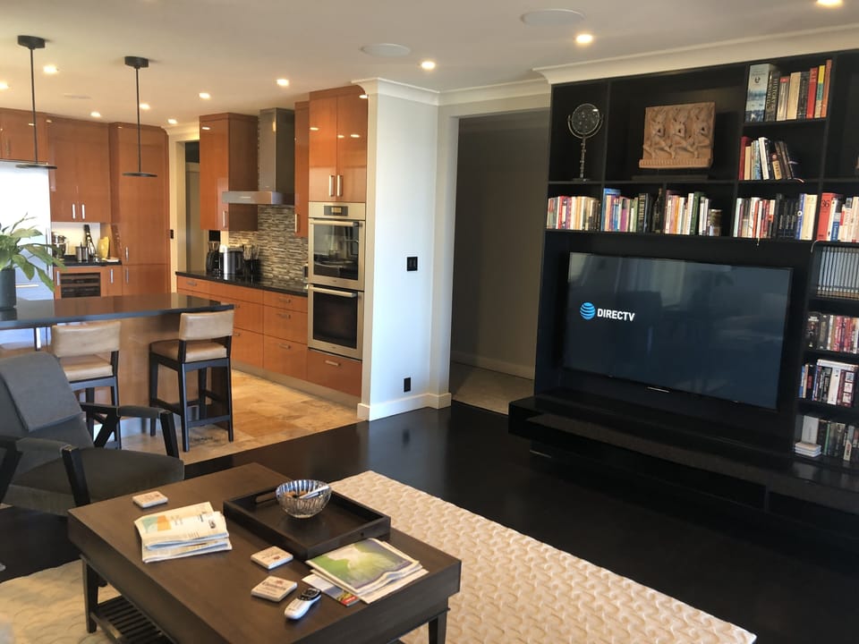 Kitchen and family room area with 60 inch HDTV with satellite service
