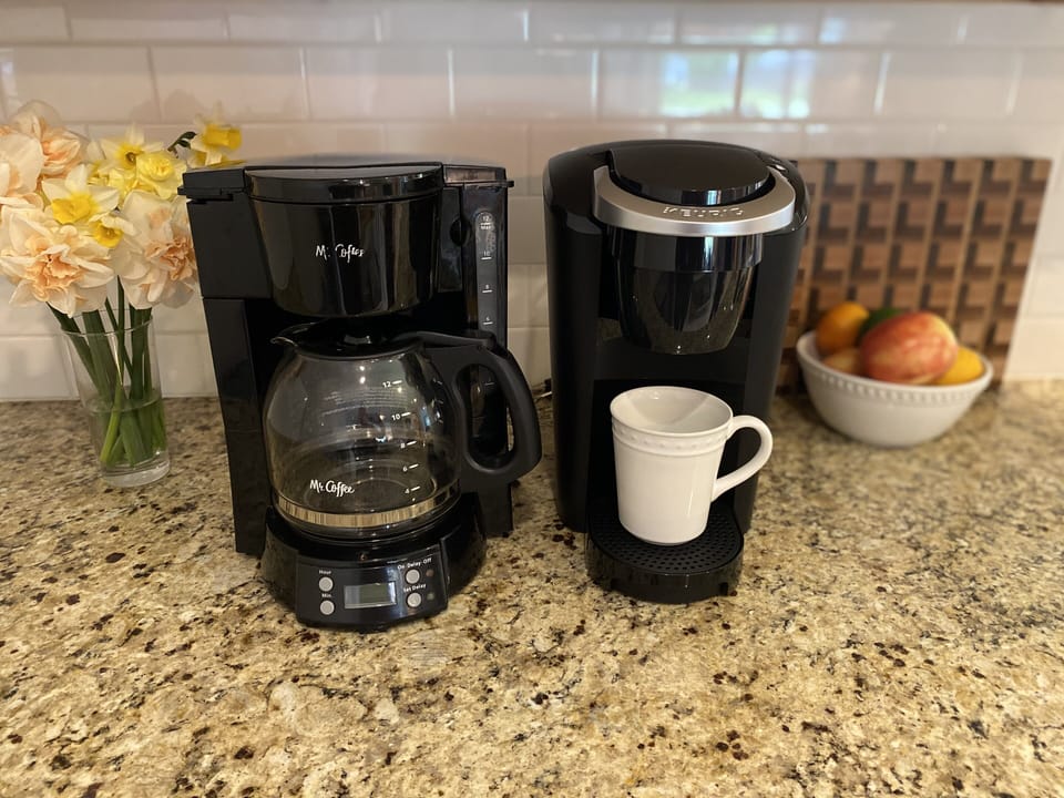 The kitchen has both a traditional drip coffee maker and a Keurig single serve. 