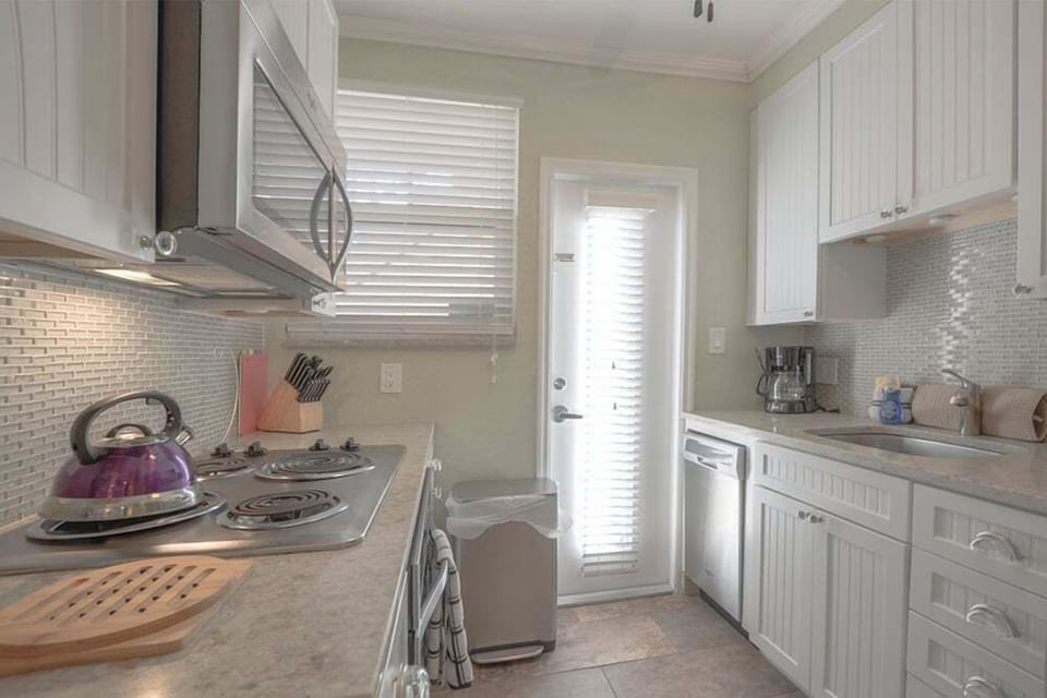 Our fully equipped kitchen includes fridge, stove, oven, microwave, dishwasher, Keurig coffee maker, and all the essentials.