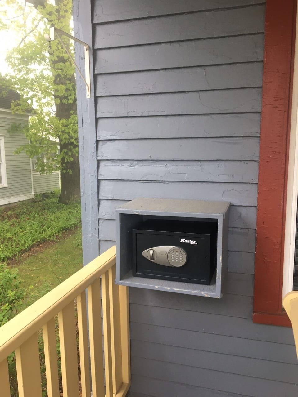 Lock box on front porch contains keys