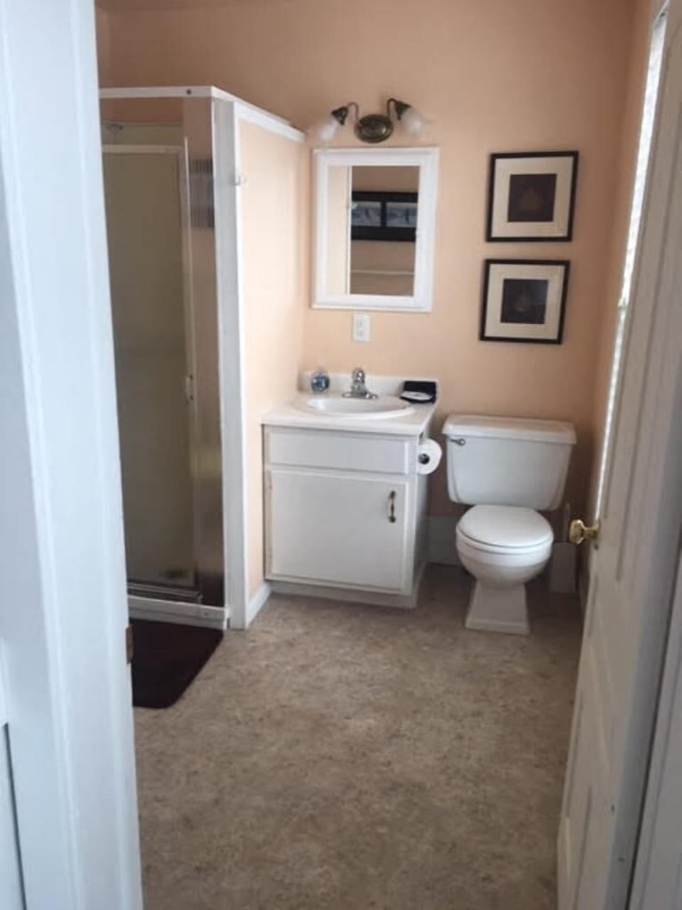 Lakeview's bath is light and airy with a view of Betsie Bay.