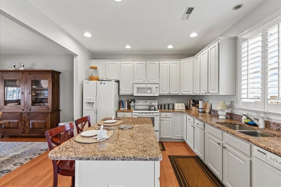 Third floor:  Eat-in kitchen island.  Granite countertops. 