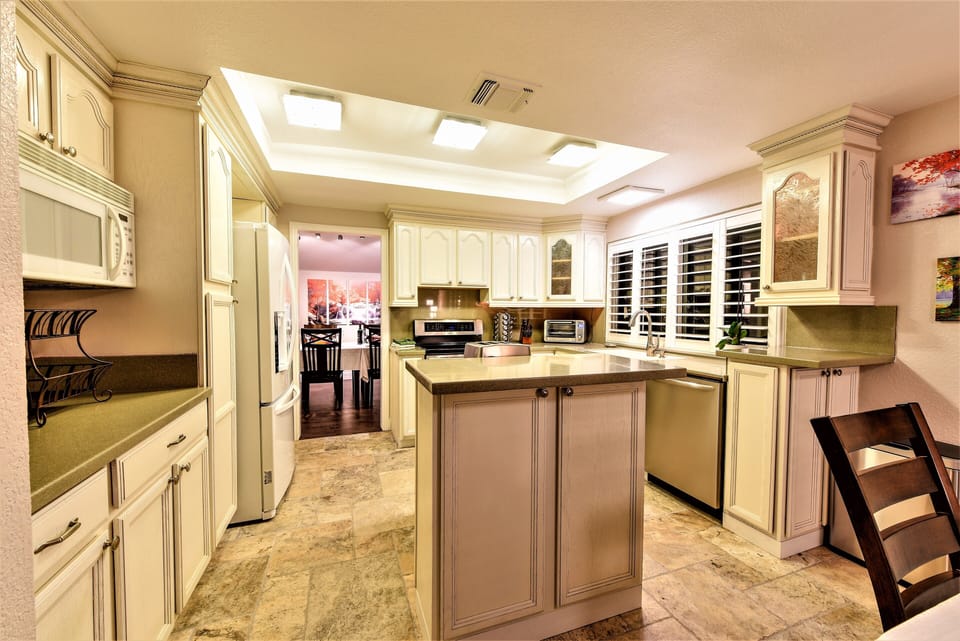 Bright kitchen, fully stocked with all you need. Open to nook and Den