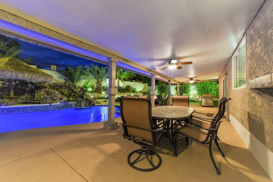 Large covered patio w/ceiling fans, dining & lounging areas,  natural gas grill.