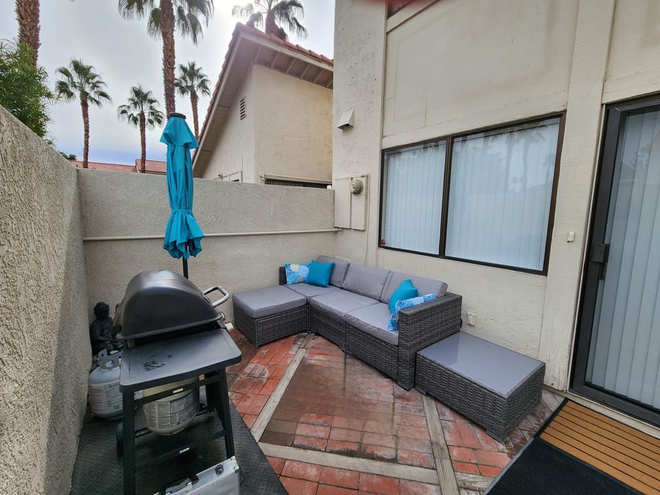 Back courtyard sitting area (area rug matching dining area recently added)