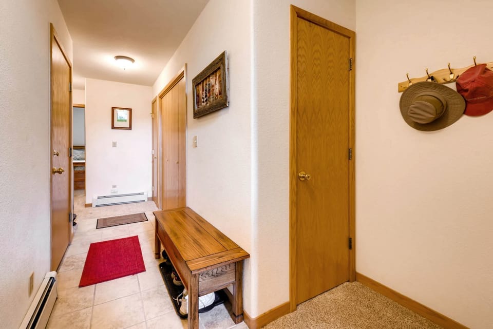 Enter the home from the private garage, take a seat and shed your coats and boots