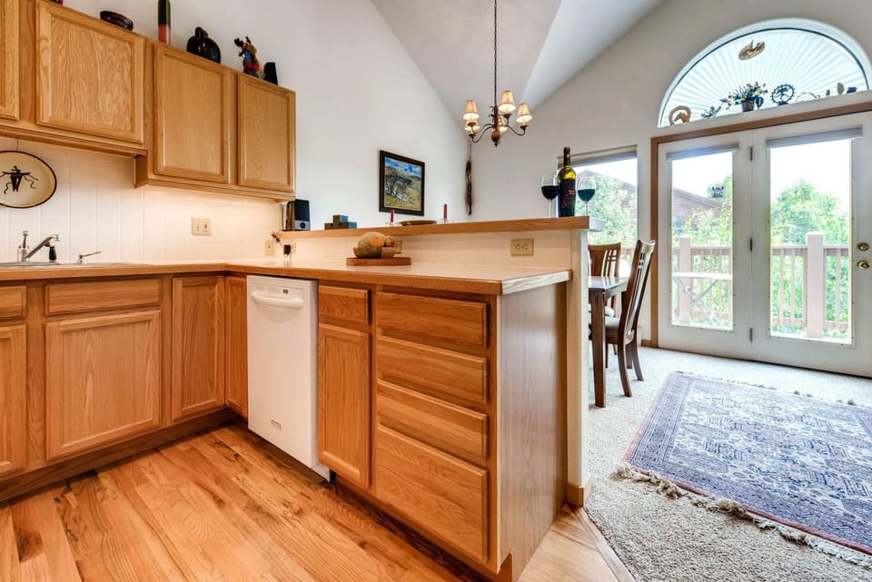 Kitchen and dining area looking out to balcony