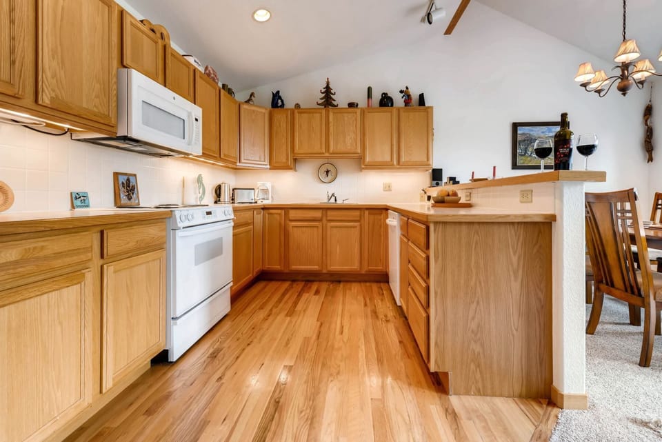 Fully equipped kitchen with cookware, utensils and flatware