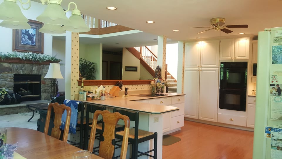 Dining room, breakfast bar in Kitchen. Two story family room with fireplace.