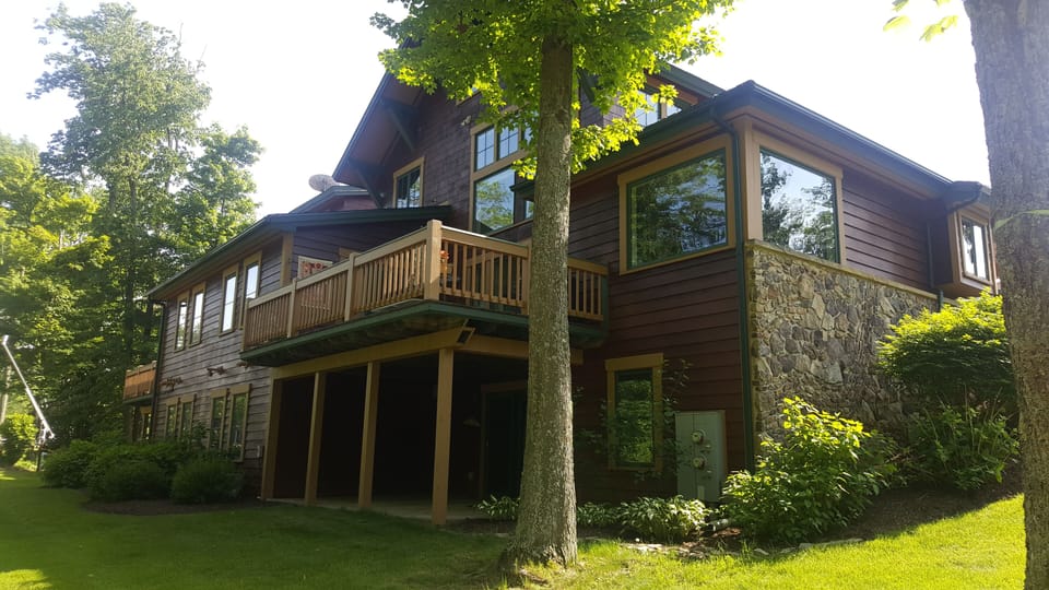 Back of condo, patio and deck above.