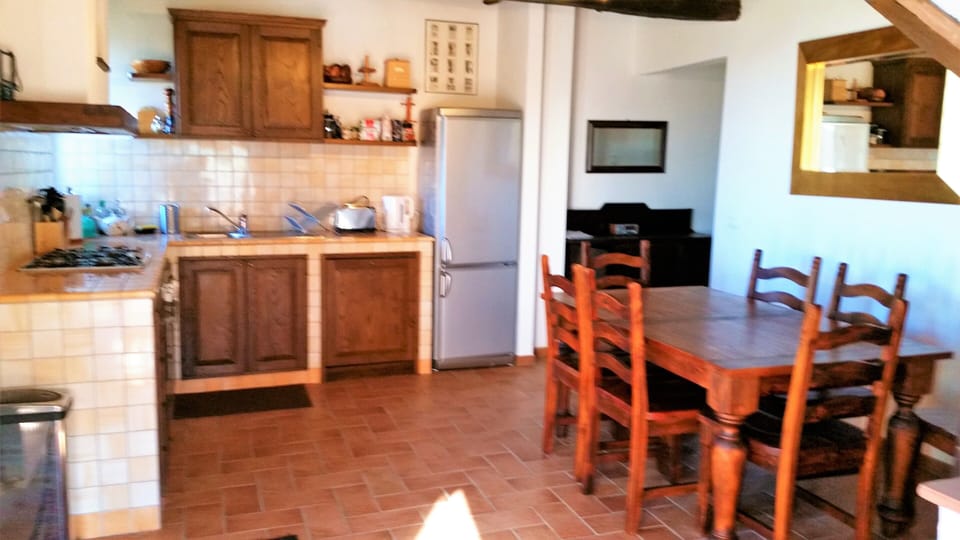 Dining kitchen. Corridor access to downstairs bedrooms to rear.