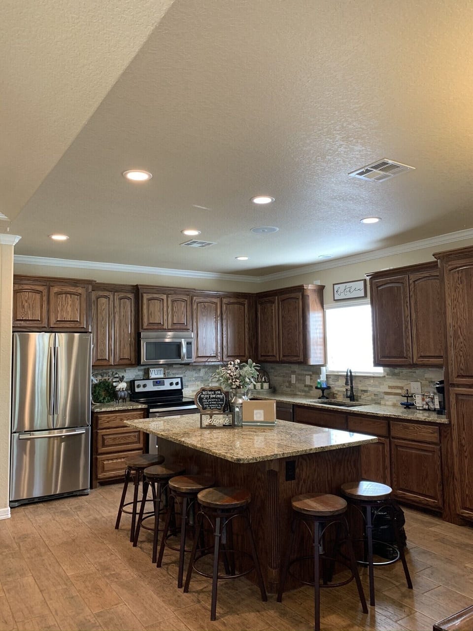 Walk in to a very spacious kitchen with big island for additional seating! 