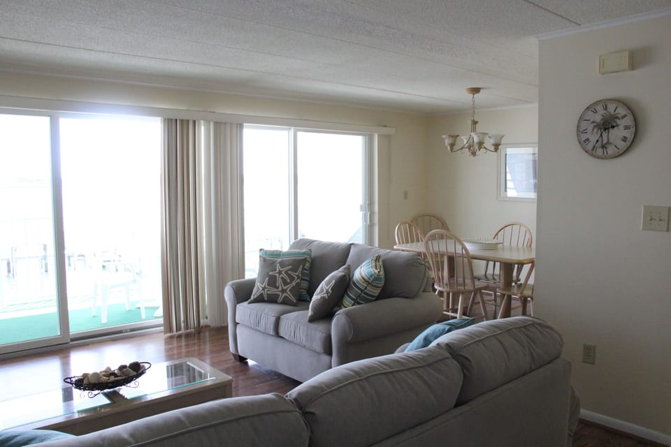 Full sliding glass doors in living space take you onto the balcony