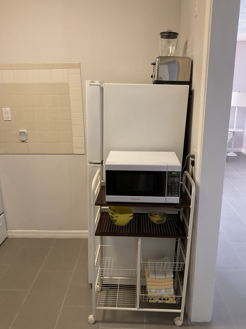 Microwave, apartment sized refrigerator.