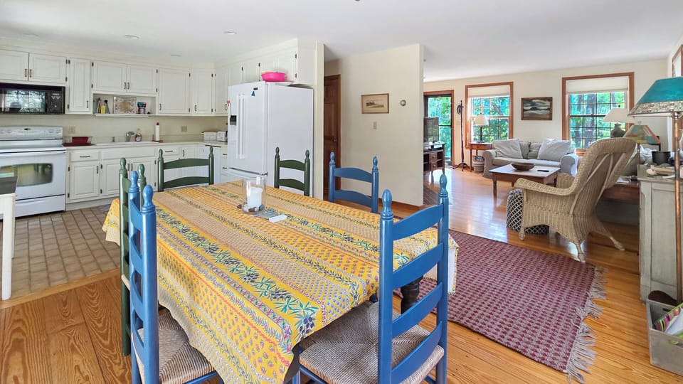 Dining area with kitchen and living room beyond
