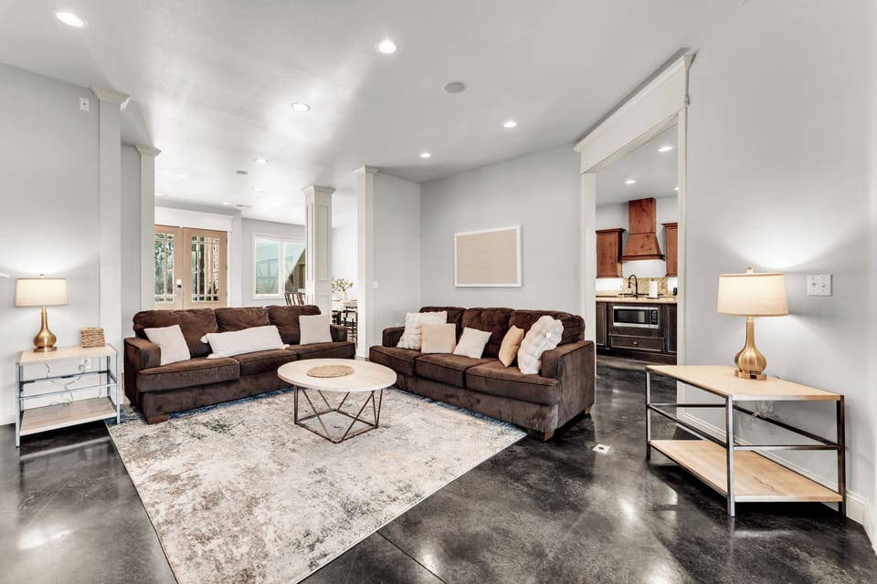 Open concept layout. View from living room into foyer/dining room/kitchen.