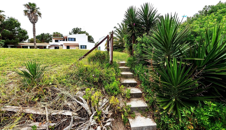 Steps from the beach to the villa garden